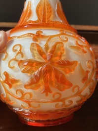 A Chinese overlay Beijing glass bottle vase with lotus scrolls in yellow on white, 19t/20h C.