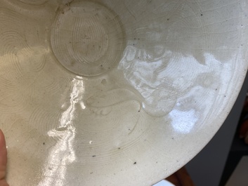 A Chinese qingbai-glazed 'phoenixes' bowl and a cream-glazed 'fish' bowl, probably Song