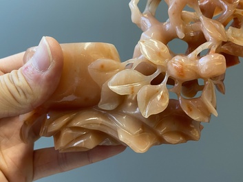 A Chinese carnelian agate sculpture of a vase with branches and birds, 20th C.