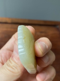 Un pendentif en jade blanc tach&eacute; de rouille et une plaque en forme de papillon en jade c&eacute;ladon, Chine, Qing/R&eacute;publique