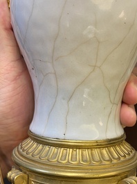 A pair of Chinese gilt bronze lamp-mounted crackle-glazed vases, 18/19th C.