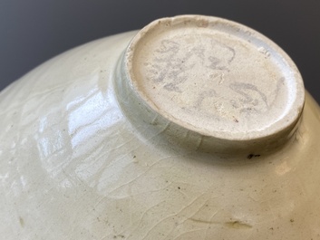 A Chinese qingbai-glazed 'phoenixes' bowl and a cream-glazed 'fish' bowl, probably Song