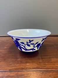 A Chinese overlay Beijing glass 'magpie and plum blossom' bowl in blue on white, 19th C.