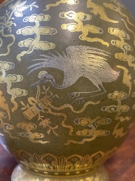 A Chinese gilt- and silver-decorated teadust-glazed vase with bats and cranes among clouds, Qianlong mark, Republic