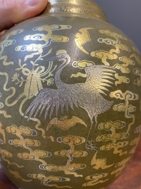 A Chinese gilt- and silver-decorated teadust-glazed vase with bats and cranes among clouds, Qianlong mark, Republic