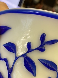 A Chinese overlay Beijing glass 'magpie and plum blossom' bowl in blue on white, 19th C.