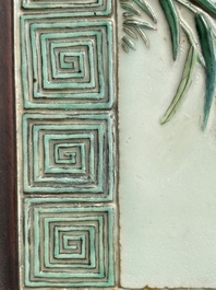 A Chinese relief-decorated famille verte 'peacock' plaque in a fine carved hongmu wooden frame, 19th C.