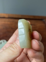 Un pendentif en jade blanc tach&eacute; de rouille et une plaque en forme de papillon en jade c&eacute;ladon, Chine, Qing/R&eacute;publique
