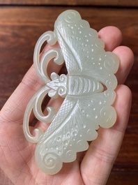 Un pendentif en jade blanc tach&eacute; de rouille et une plaque en forme de papillon en jade c&eacute;ladon, Chine, Qing/R&eacute;publique