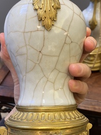 A pair of Chinese gilt bronze lamp-mounted crackle-glazed vases, 18/19th C.