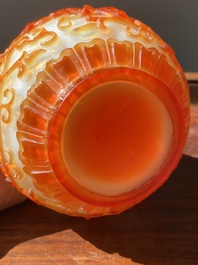 A Chinese overlay Beijing glass bottle vase with lotus scrolls in yellow on white, 19t/20h C.
