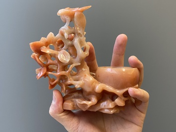 A Chinese carnelian agate sculpture of a vase with branches and birds, 20th C.