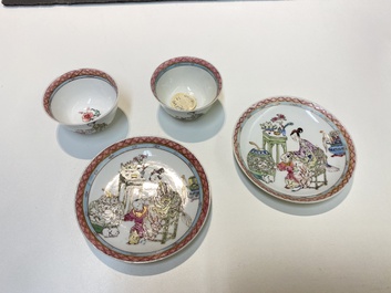 A pair of Chinese famille rose cups and saucers with a lady and a boy, Yongzheng