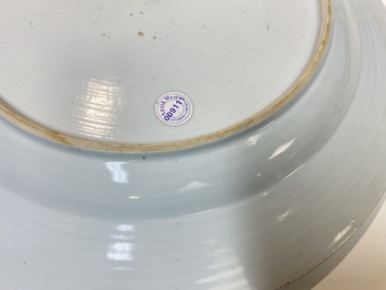 A Chinese famille rose dish with two ladies and a boy in a garden, Yongzheng
