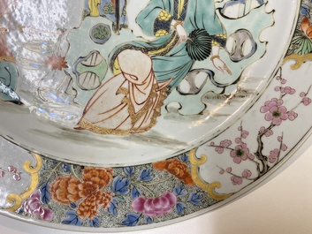 A Chinese famille rose dish with two ladies and a boy in a garden, Yongzheng