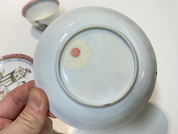 A pair of Chinese famille rose cups and saucers with a lady and a boy, Yongzheng