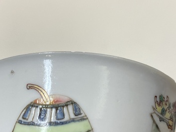 A pair of Chinese famille rose cups and saucers with a lady and a boy, Yongzheng
