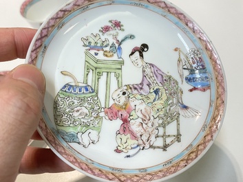 A pair of Chinese famille rose cups and saucers with a lady and a boy, Yongzheng