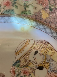 A pair of fine Chinese famille rose plates with a lady and two boys, Yongzheng