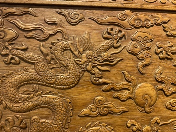 A Chinese rectangular huanghuali wooden box and cover with dragons, 17/18th C.