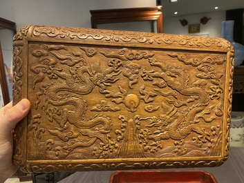 A Chinese rectangular huanghuali wooden box and cover with dragons, 17/18th C.