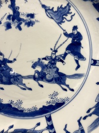 Three large deep Chinese blue and white 'hunting scene' dishes, Chenghua mark, Kangxi