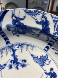 Three large deep Chinese blue and white 'hunting scene' dishes, Chenghua mark, Kangxi