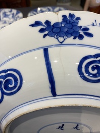 Three large deep Chinese blue and white 'hunting scene' dishes, Chenghua mark, Kangxi