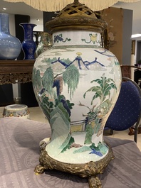 Un vase en porcelaine de Chine famille verte mont&eacute; en lampe, Kangxi
