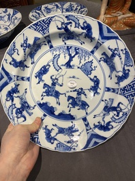 Three large deep Chinese blue and white 'hunting scene' dishes, Chenghua mark, Kangxi