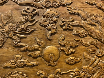 A Chinese rectangular huanghuali wooden box and cover with dragons, 17/18th C.