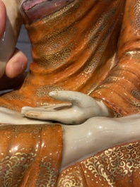 A Chinese famille rose figure of Buddha, Qianlong mark, 19/20th C.