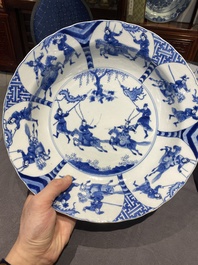Three large deep Chinese blue and white 'hunting scene' dishes, Chenghua mark, Kangxi