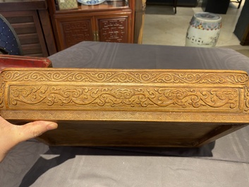 A Chinese rectangular huanghuali wooden box and cover with dragons, 17/18th C.