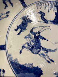 Three large deep Chinese blue and white 'hunting scene' dishes, Chenghua mark, Kangxi