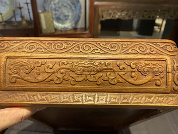 A Chinese rectangular huanghuali wooden box and cover with dragons, 17/18th C.