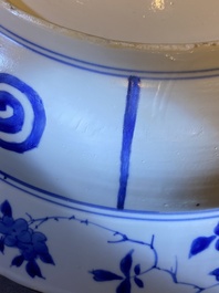 Three large deep Chinese blue and white 'hunting scene' dishes, Chenghua mark, Kangxi