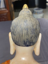 A Chinese famille rose figure of Buddha, Qianlong mark, 19/20th C.