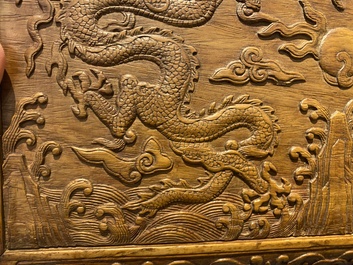 A Chinese rectangular huanghuali wooden box and cover with dragons, 17/18th C.
