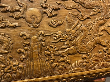 A Chinese rectangular huanghuali wooden box and cover with dragons, 17/18th C.