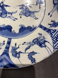 Three large deep Chinese blue and white 'hunting scene' dishes, Chenghua mark, Kangxi