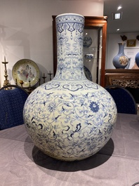 A large Chinese blue and white bottle vase, Qianlong mark, 19/20th C.
