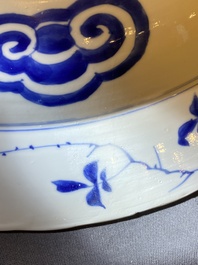 Three large deep Chinese blue and white 'hunting scene' dishes, Chenghua mark, Kangxi
