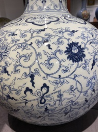 A large Chinese blue and white bottle vase, Qianlong mark, 19/20th C.