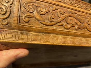 A Chinese rectangular huanghuali wooden box and cover with dragons, 17/18th C.