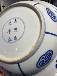 Three large deep Chinese blue and white 'hunting scene' dishes, Chenghua mark, Kangxi