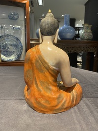 A Chinese famille rose figure of Buddha, Qianlong mark, 19/20th C.