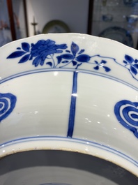 Three large deep Chinese blue and white 'hunting scene' dishes, Chenghua mark, Kangxi