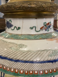 Un vase en porcelaine de Chine famille verte mont&eacute; en lampe, Kangxi