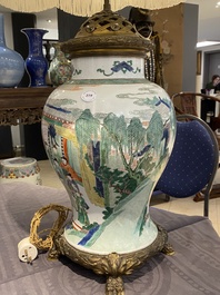 Un vase en porcelaine de Chine famille verte mont&eacute; en lampe, Kangxi
